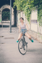Naklejki young hipster woman with bike