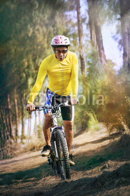 young man riding mountain bike mtb in jungle track use for sport