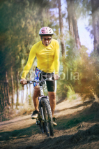 Obrazy i plakaty young man riding mountain bike mtb in jungle track use for sport