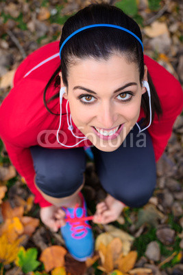 Cheerful female athlete ready for running