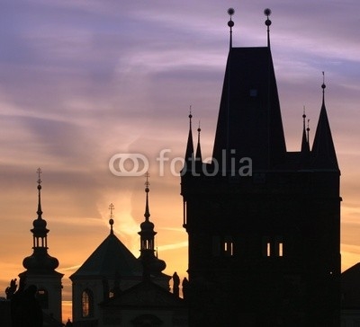 Silhouettes of Prague towers at dawn