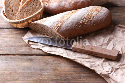 Fresh bread on wooden background