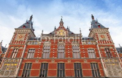 Facade of Amsterdam Centraal old building. Central railroad stat