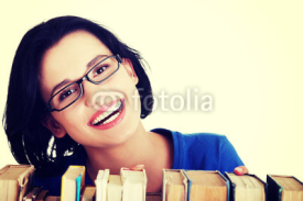 Naklejki Happy smiling young student woman with books