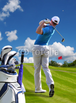 Naklejki Man playing golf against blue sky with golf bag