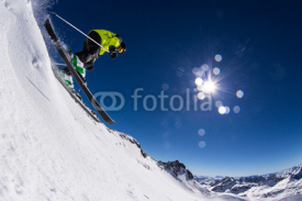 Fototapety Alpine skier on piste, skiing downhill