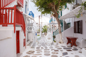 Mykonos town streetview with tree and red banisters, Mykonos town, Greece