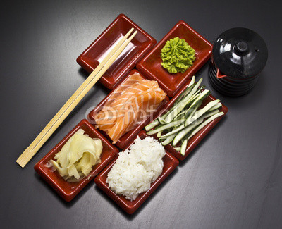 Ingredients for sushi: sliced salmon cucumber rice 