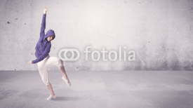 Pretty urban dancer with empty background