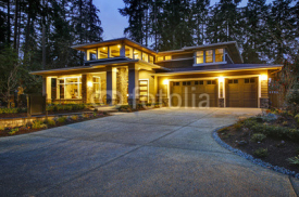 Luxurious new construction home exterior at sunset