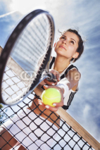 Fototapety Beautiful young girl rests on a tennis net