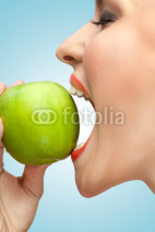 Biting apple.
