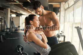 Personal trainer helping