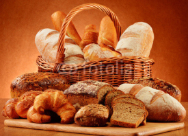 Fototapety Wicker basket with variety of baking products