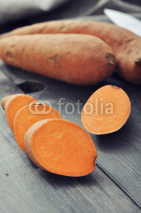 Naklejki Raw sweet potatoes