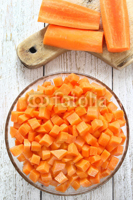 Diced carrots in glass bowl