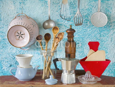 Various vintage kitchen utensils,against blue wall