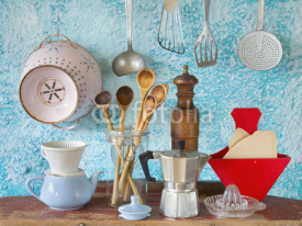 Fototapety Various vintage kitchen utensils,against blue wall