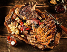 Fototapety Variety of barbecue meat served on table