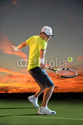 Man Playing Tennis at Sunset