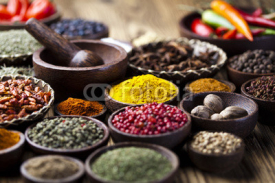 Fototapety Assortment of spices in wooden bowl background 
