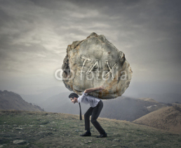 Naklejki Man carrying a heavy rock