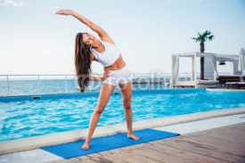 Naklejki Girl doing yoga exercises