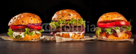 Naklejki Fresh home-made hamburgers served on stone