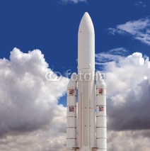 Naklejki Spaceship against the cloudy sky background