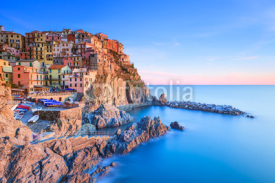 Obrazy i plakaty Manarola village, rocks and sea at sunset. Cinque Terre, Italy