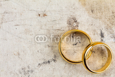 Wedding rings on dirty canvas