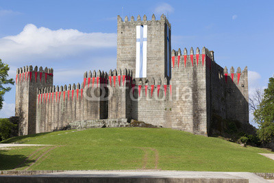 Guimaraes castle with the flag of the city, north of Portugal