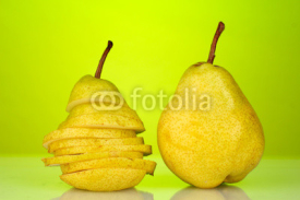 Fototapety Ripe pears on bright green background