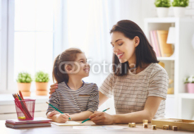 woman teaches child the alphabet