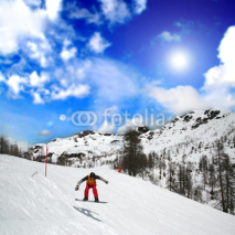 Naklejki Snowboarding in an alpine landscape