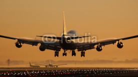 Naklejki Airplane sunrise landing