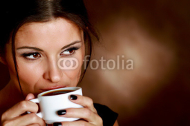 Woman with an aromatic coffee in hands