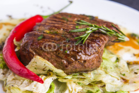 Naklejki Grilled veal steak with vegetables on a plate