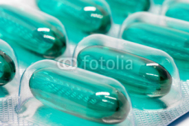 Fototapety green soft gel capsules pills in blister pack