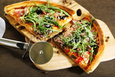 Piece of pizza with arugula