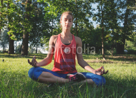 Fototapety Sport woman enjoying meditation in a city park