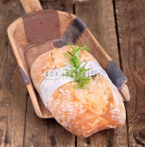 Fototapety Ciabatta Brot auf rustikalen Holzschieber