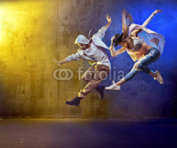 Naklejki Stylish dancers fancing in a concrete area
