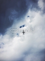 Fototapety Airplane and dark clouds