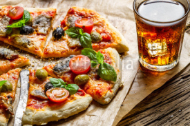 Fototapety Freshly baked pizza served with a cold drink