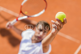 Naklejki Young man playing tennis