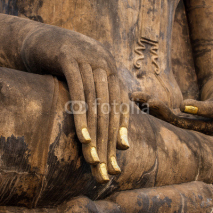 Fototapety Hand of an ancient Buddha statue in the temple of Sukhothai Hist