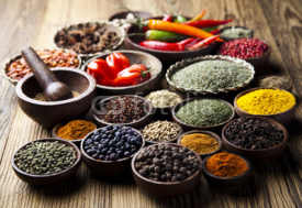 Naklejki Spices on wooden bowl background 