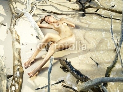 Nude woman on beach