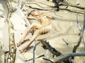 Naklejki Nude woman on beach